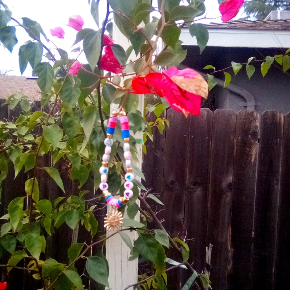 This is a bracket that has a sun with vibrant colors